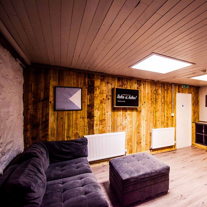 There's loads of space to relax in the living room area of our Longhouse at Boreland Loch Tay